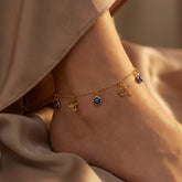 minimalist gold-filled anklet featuring a symbolic charm, designed for everyday elegance and protective style