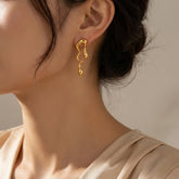 sculpted gold-plated stainless steel earrings with a modern fluid design