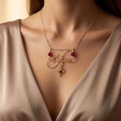 triple birthstone swirl name necklace featuring a personalized elegant swirl design with three sparkling birthstones