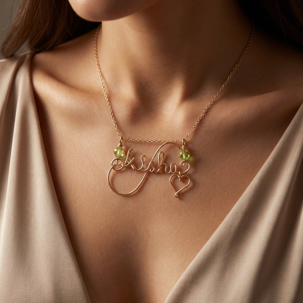swash script name necklace with birthstone crystal in heart swirl design, crafted in dubai